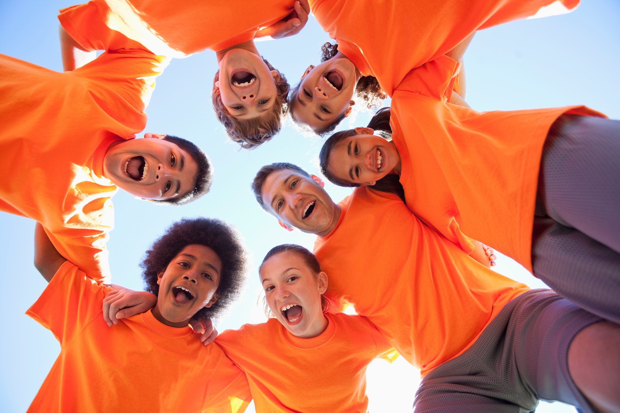 Coach-with-group-of-children-480977573_5616x3744